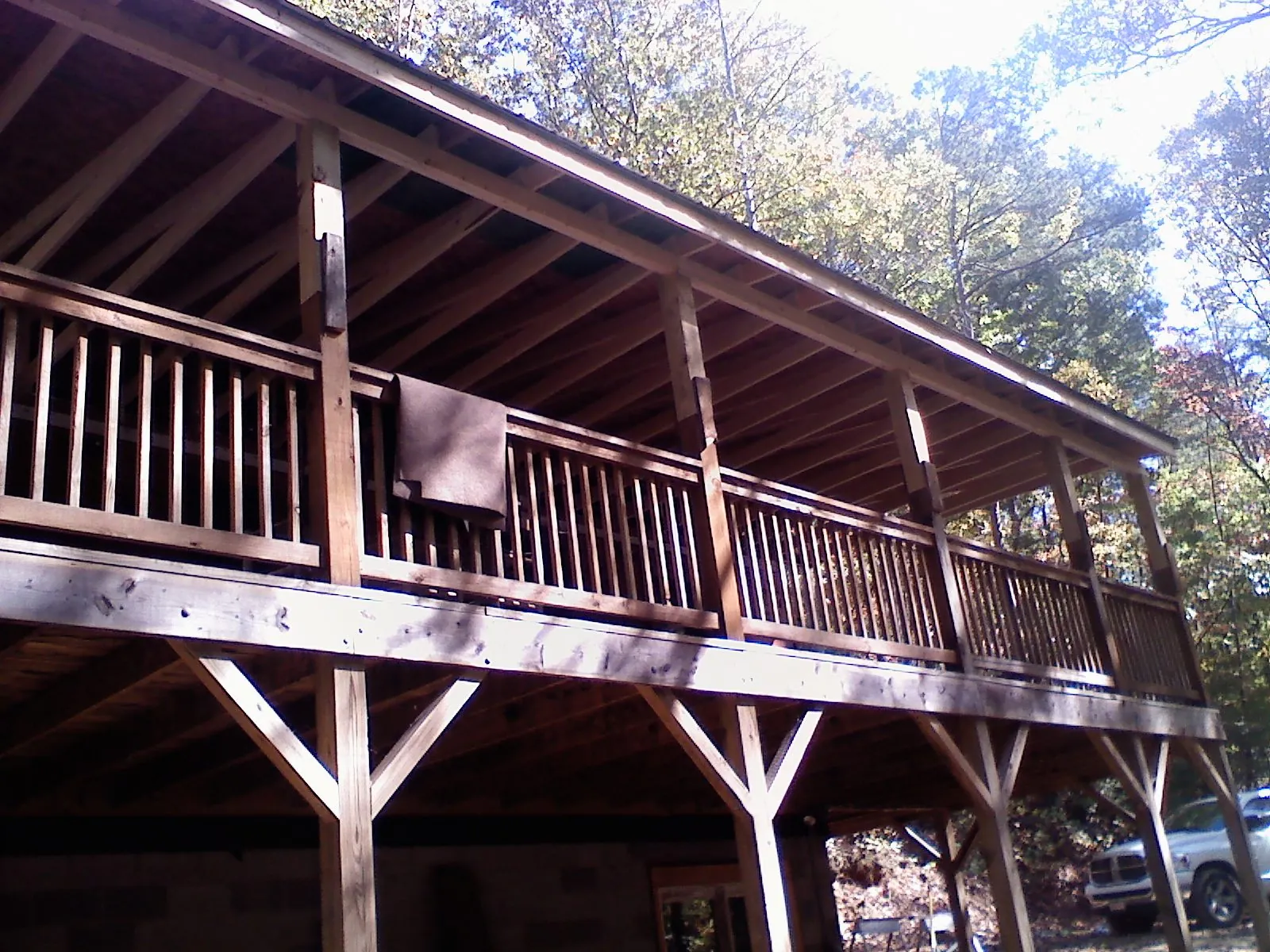 Timber framing under a new elevated porch and deck — Roof Leak Repair in De Witt by Roofing Brothers
